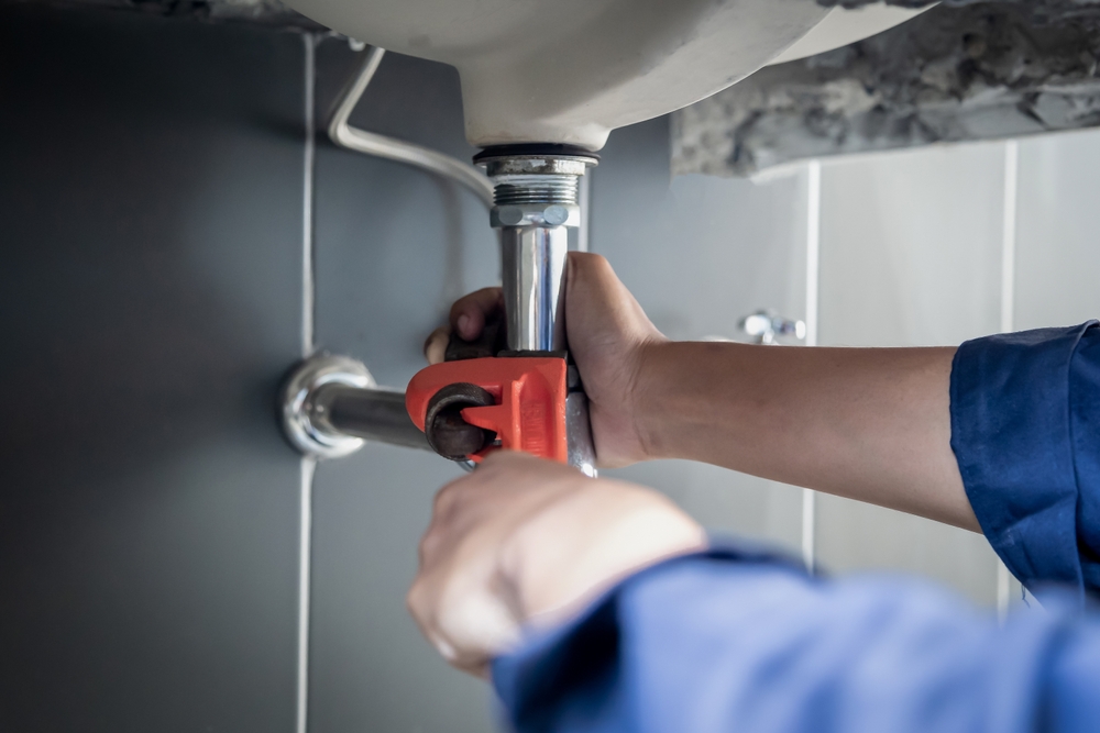 Plumber,Uses,Wrench,To,Repair,Water,Pipe,Under,Sink,There Plumber,Uses,Wrench,To,Repair,Water,Pipe,Under,Sink,There