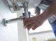 Professional,Plumber,Fixing,A,Faulty,Bathroom,Sink,,He,Is,Using