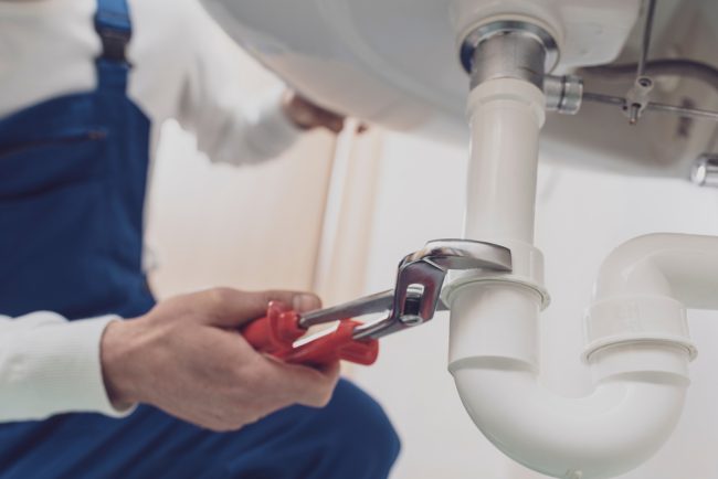 Professional,Plumber,Installing,Or,Fixing,A,Sink,At,Home Professional,Plumber,Installing,Or,Fixing,A,Sink,At,Home
